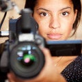 Woman holding up a camera