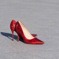 Red high heels on floor
