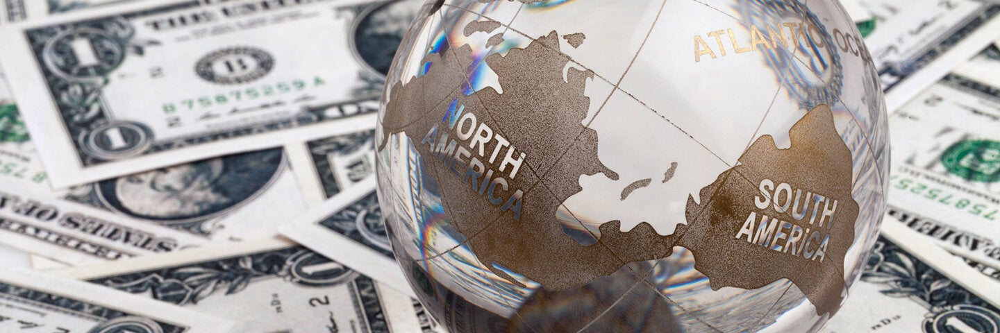 globe on top of American cash 