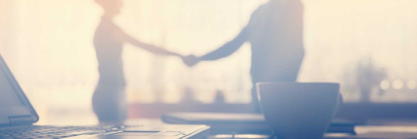 male and female shaking hands