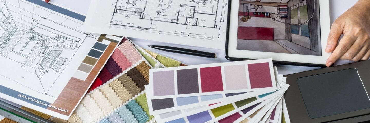 Interior Designer looking over portfolio materials