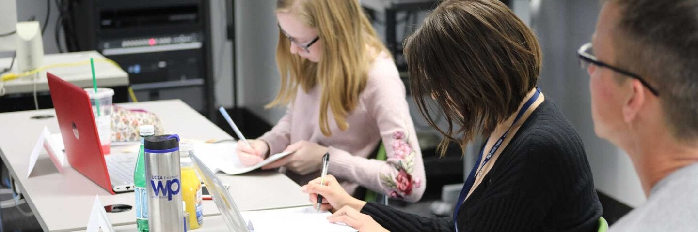 Writers making notes in writers room