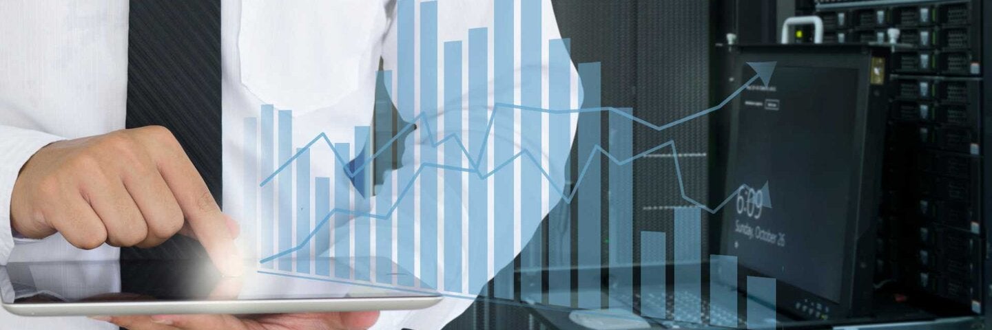 Business man use tablet for analyze in data center