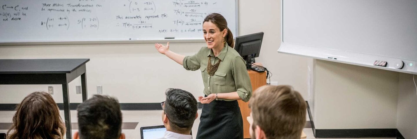 Instructor talking to students in classroom