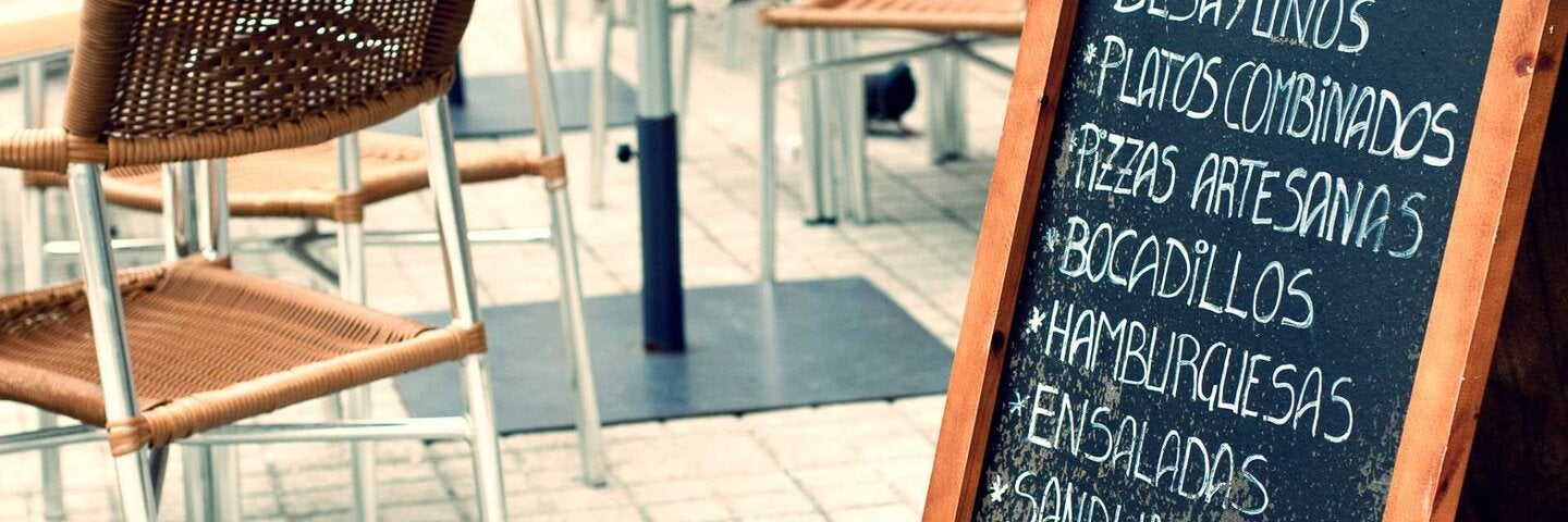 Chalkboard menu in spanish on a terrace