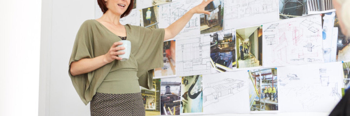woman teaching design and architecture to senior woman 