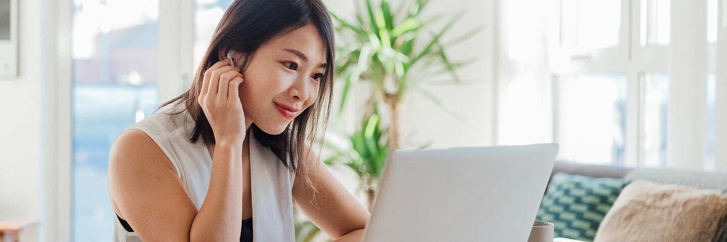 female looking at laptop computer