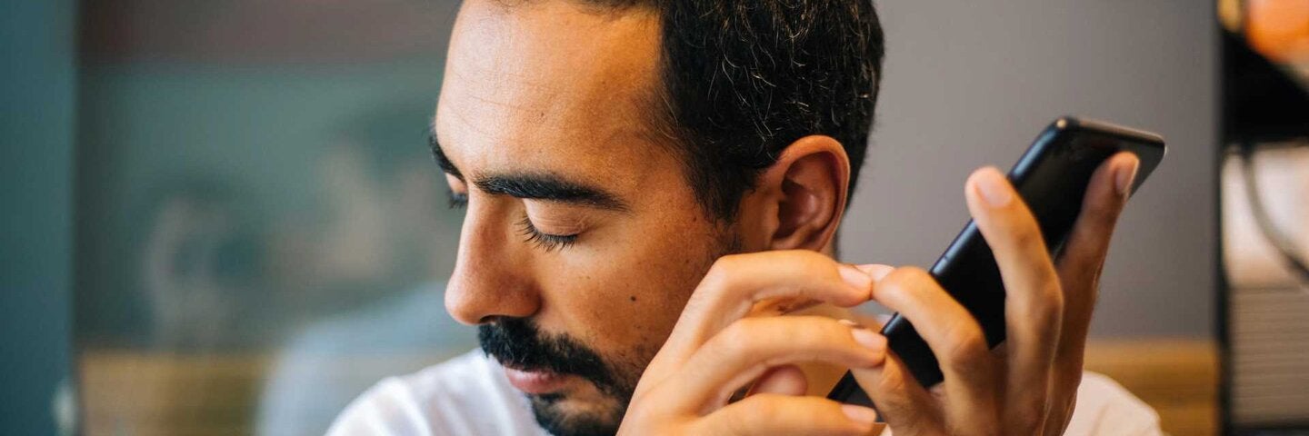 Blind person using accessibility options on phone