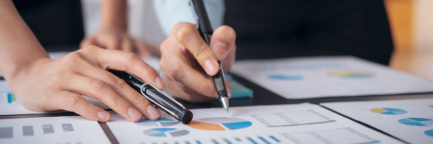 Colleagues analyzing data together