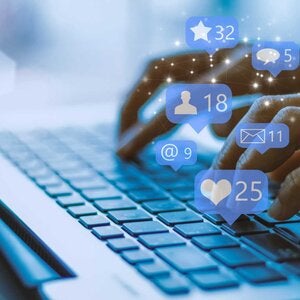 businesswoman on a laptop using social media