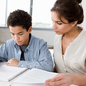 Female teacher with young boy