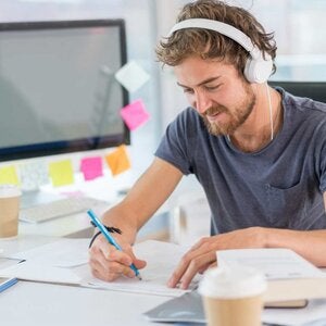 man sitting in front of computer